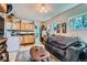 Inviting living room with warm wood cabinets, appliances, and cozy seating area at 347 Bannock St, Denver, CO 80223