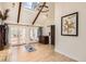 Bright living room boasts high ceilings, exposed beams, skylight, and French doors to the exterior at 347 Bannock St, Denver, CO 80223