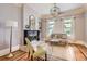 Cozy living room featuring a fireplace, hardwood floors, and ample natural light from large windows at 347 Bannock St, Denver, CO 80223