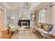 Bright living room with hardwood floors, a fireplace, and stylish decor at 347 Bannock St, Denver, CO 80223