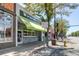 Sweet Action Ice Cream shop, street view of building front with green awning at 347 Bannock St, Denver, CO 80223