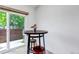 Inviting breakfast nook with a round table and seating for two, positioned near a sliding glass door at 18384 E Bethany Pl, Aurora, CO 80013