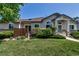 Charming single Gathering home features a well-kept lawn and welcoming front entrance at 18384 E Bethany Pl, Aurora, CO 80013