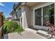 Charming outdoor patio with sliding glass door access and adjacent landscaping at 18384 E Bethany Pl, Aurora, CO 80013