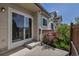 Exterior view of a patio area with sliding glass door, steps and low garden featuring greenery at 18384 E Bethany Pl, Aurora, CO 80013