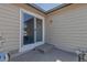 Enclosed patio with sliding glass door leading inside and exterior lighting at 18384 E Bethany Pl, Aurora, CO 80013