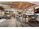 Basement bar with wood ceiling, rustic shelving, and lots of seating at 5261 Sedona Dr, Parker, CO 80134