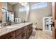 Bathroom featuring double vanity with granite countertops, modern fixtures, and natural light at 5261 Sedona Dr, Parker, CO 80134