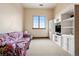 Bonus room featuring built in shelving unit with cabinets and large bright window at 5261 Sedona Dr, Parker, CO 80134
