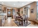 Charming breakfast nook featuring hardwood floors, built-in cabinets, and natural light from a large window at 5261 Sedona Dr, Parker, CO 80134