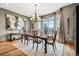 Elegant dining room with a large window, chandelier, and a formal dining set at 5261 Sedona Dr, Parker, CO 80134