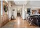 Inviting foyer featuring hardwood floors, an arched doorway, and views into the living room at 5261 Sedona Dr, Parker, CO 80134