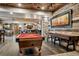 Open floor plan includes Game room with pool table, shuffle board, and bar area at 5261 Sedona Dr, Parker, CO 80134
