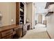 Hallway featuring built-in desk, storage and open floorplan view at 5261 Sedona Dr, Parker, CO 80134