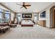 Spacious primary bedroom with large windows, sitting area and neutral tones at 5261 Sedona Dr, Parker, CO 80134