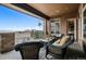Covered patio with comfortable seating and panoramic views at 5261 Sedona Dr, Parker, CO 80134