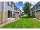 Manicured backyard showcasing a grassy lawn and fenced-in patios at 17225 Lark Water Ln # C, Parker, CO 80134