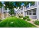 Lush green backyard with a manicured lawn and wood privacy fences at 17225 Lark Water Ln # C, Parker, CO 80134