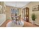 Cozy dining room with natural light, elegant chandelier, and convenient access to the patio at 17225 Lark Water Ln # C, Parker, CO 80134