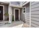 Charming entryway with a dark brown door and tasteful landscaping at 17225 Lark Water Ln # C, Parker, CO 80134