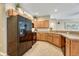 Spacious kitchen with wooden cabinets, granite counters, and stainless steel appliances at 17225 Lark Water Ln # C, Parker, CO 80134