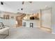 Open living area with carpeting, breakfast bar and staircase at 17225 Lark Water Ln # C, Parker, CO 80134