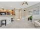 Neutral living area features breakfast bar with views of the kitchen at 17225 Lark Water Ln # C, Parker, CO 80134