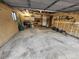 Spacious garage with concrete floor, shelving, and ample storage space for vehicles and tools at 17421 E Grand Ave, Aurora, CO 80015
