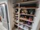 Pantry with an organized shelving system for ample storage at 17421 E Grand Ave, Aurora, CO 80015