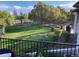 Secluded backyard with manicured lawn, stone walkway, and mature landscaping at 3080 Big Bear Dr, Sedalia, CO 80135