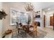 Charming breakfast nook with bay window, fireplace, and cozy seating at 3080 Big Bear Dr, Sedalia, CO 80135