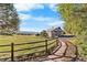 Exterior view of a barn featuring stone accents, a metal roof, and an adjacent stone path at 3080 Big Bear Dr, Sedalia, CO 80135