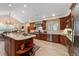 Spacious kitchen with custom wood cabinets, granite countertops, stainless steel appliances, and a large center island at 3080 Big Bear Dr, Sedalia, CO 80135