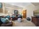 Comfortable living room with leather sofa set, plush pillows, and warm lighting at 3080 Big Bear Dr, Sedalia, CO 80135