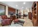 Executive office with leather furnishings, built-in shelving, and natural light at 3080 Big Bear Dr, Sedalia, CO 80135