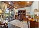 Home office with custom built-ins, dark wood trim, and outdoor access at 3080 Big Bear Dr, Sedalia, CO 80135