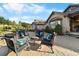 Back patio featuring outdoor seating and lush landscaping at 3080 Big Bear Dr, Sedalia, CO 80135
