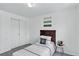 Bedroom with a single bed, decor and a side table next to a closet at 1920 E 145Th Ave, Thornton, CO 80602