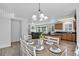 Open dining area seamlessly connects the kitchen and living spaces, with hardwood floors at 1920 E 145Th Ave, Thornton, CO 80602