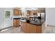 Modern kitchen with island, stainless appliances, and ample cabinet space is perfect for cooking at 1920 E 145Th Ave, Thornton, CO 80602