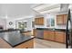 Spacious kitchen boasts granite countertops, modern appliances, and a functional layout at 1920 E 145Th Ave, Thornton, CO 80602