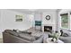 The living room features a fireplace, new flooring, and neutral decor at 1920 E 145Th Ave, Thornton, CO 80602