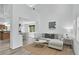 Bright living room featuring vaulted ceilings, modern decor, and light hardwood floors at 1920 E 145Th Ave, Thornton, CO 80602