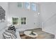 Bright living room with vaulted ceiling, staircase and modern decor with luxury vinyl plank flooring at 1920 E 145Th Ave, Thornton, CO 80602