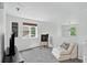 Cozy loft area with chair, TV, and view of neighborhood at 1920 E 145Th Ave, Thornton, CO 80602