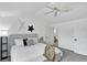 Main bedroom features a bed and access to an ensuite bathroom at 1920 E 145Th Ave, Thornton, CO 80602