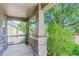 Inviting covered front porch with stone columns offers a cozy outdoor space at 1920 E 145Th Ave, Thornton, CO 80602