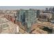 Aerial view of a high-rise building in a city neighborhood at 1700 Bassett St # 1008, Denver, CO 80202
