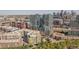 An aerial view of a modern highrise among other buildings at 1700 Bassett St # 1008, Denver, CO 80202