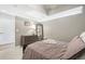 Well-lit bedroom boasts a large mirror, dresser, and a cozy queen-sized bed at 1700 Bassett St # 1008, Denver, CO 80202